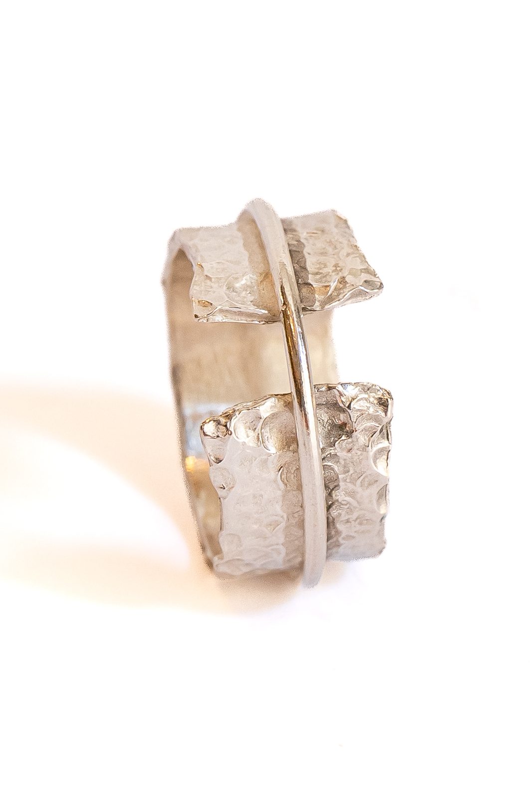 Silver ring with an overlapping band