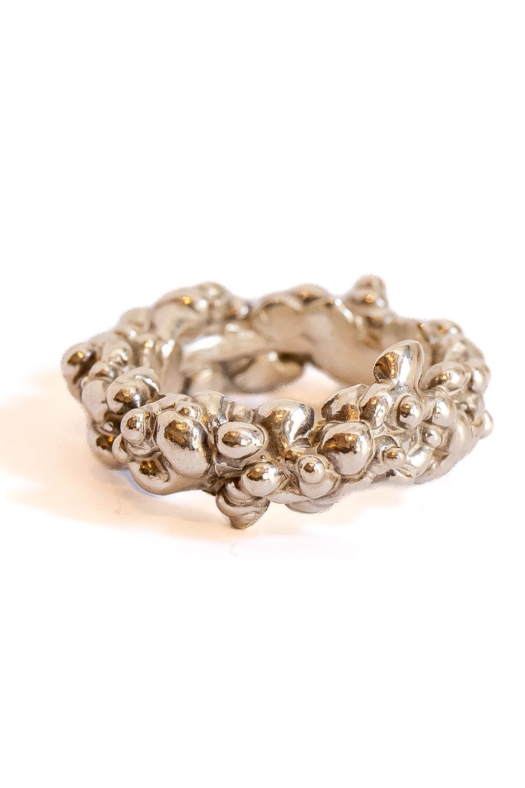 Silver ring with a droplet relief