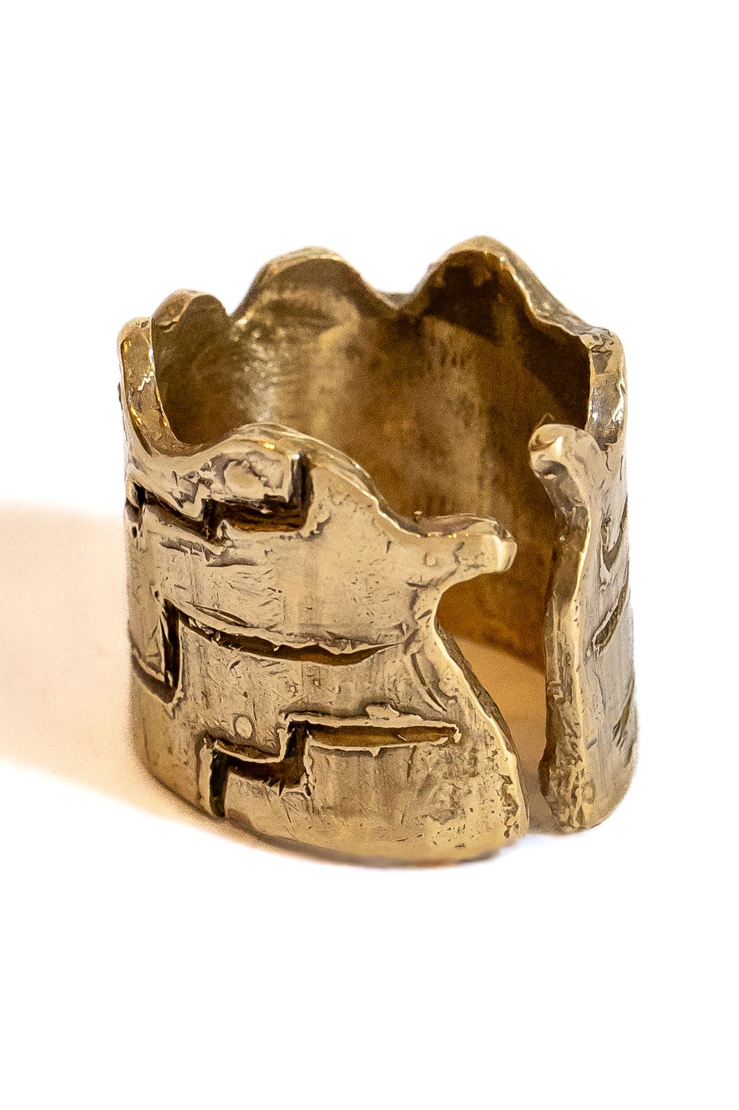 Wide bronze ring with cut-outs